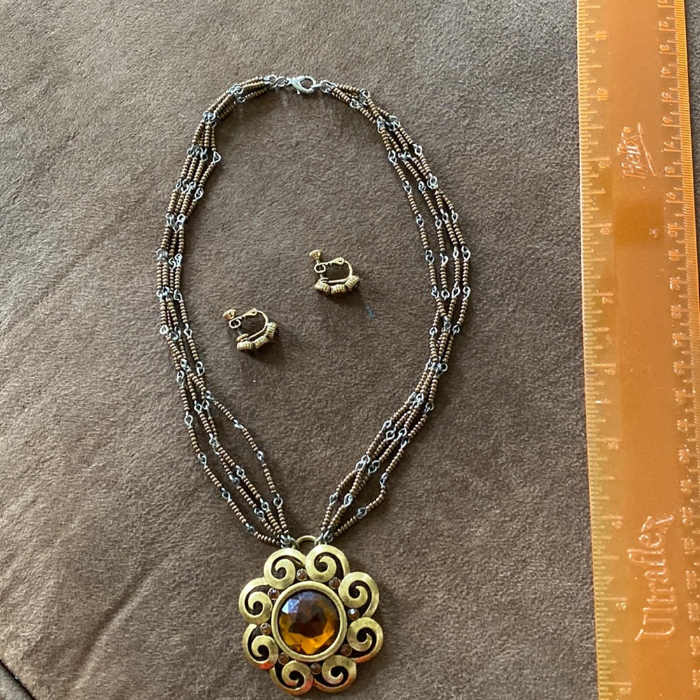 Necklace and clip on earring set.